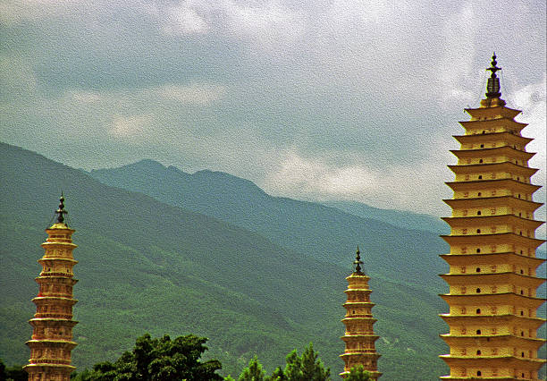The Three Pagodas stand near Dali Old Town in Yunnan Province, China. These ancient structures are part of the Chongsheng Temple complex, built during the Tang Dynasty.