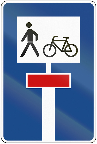 German traffic sign: dead end street continued by a bikepath and footpath.