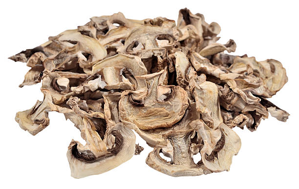 istock Heap of dried mushrooms on a white 537715491