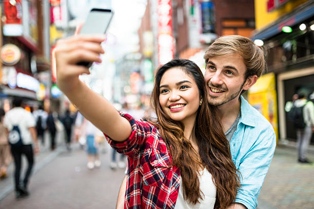 istock lovers take a selfie in Tokyo 537715706