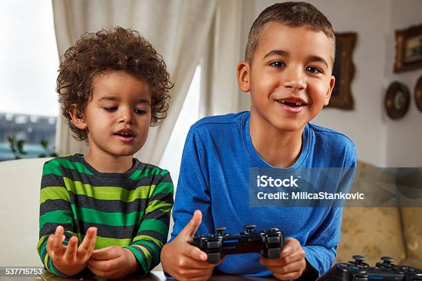 Two Friends Playing Video Game Stock Photo - Download Image Now - 2015,  African Ethnicity, Afro Hairstyle - iStock