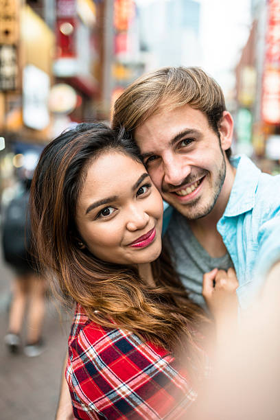 istock lovers take a selfie in Tokyo 537715846