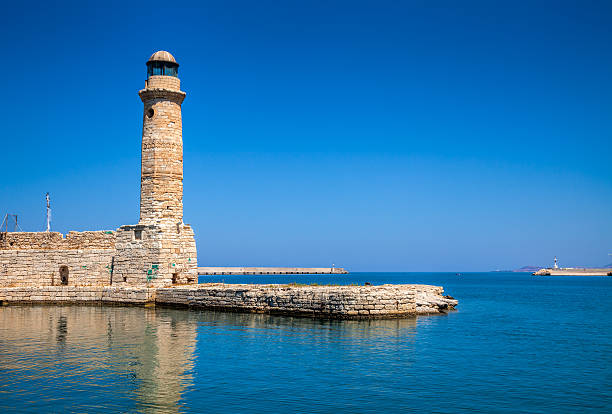 istock Lighthouse and wall at old Venetian harbour in Rethymno Crete 537716326