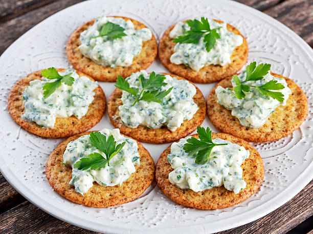 istock Bisquit cracker appetizers with cottage chees and parsley topping 537716438