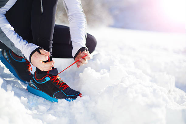 istock Man jogging in winter nature 537716757