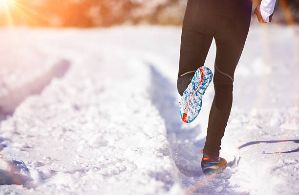 istock Man jogging in winter nature 537716767