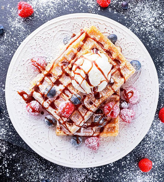 istock Belgian waffles with ice cream, chocolate sauce and fresh berries. 537716812