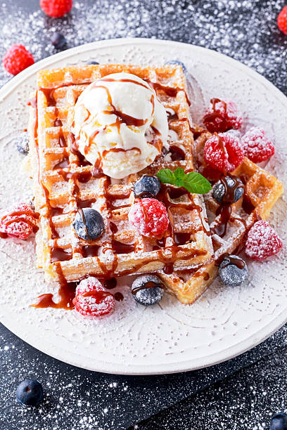 istock Belgian waffles with ice cream, chocolate sauce and fresh berries. 537716968