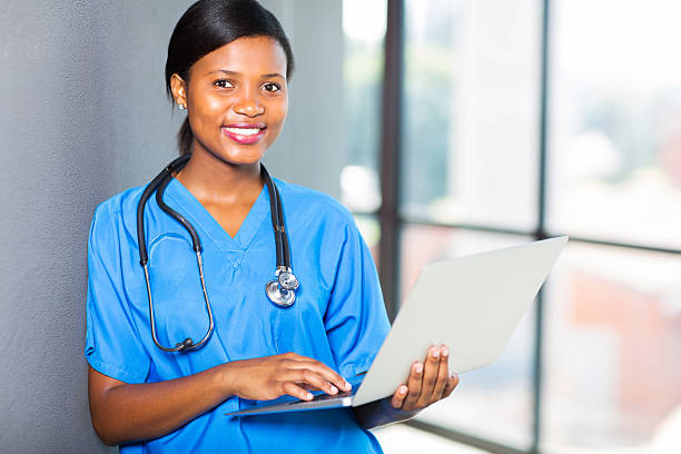istock african healthcare worker using laptop 537717525