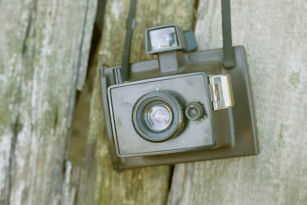 istock Vintage camera on wooden background 537719157