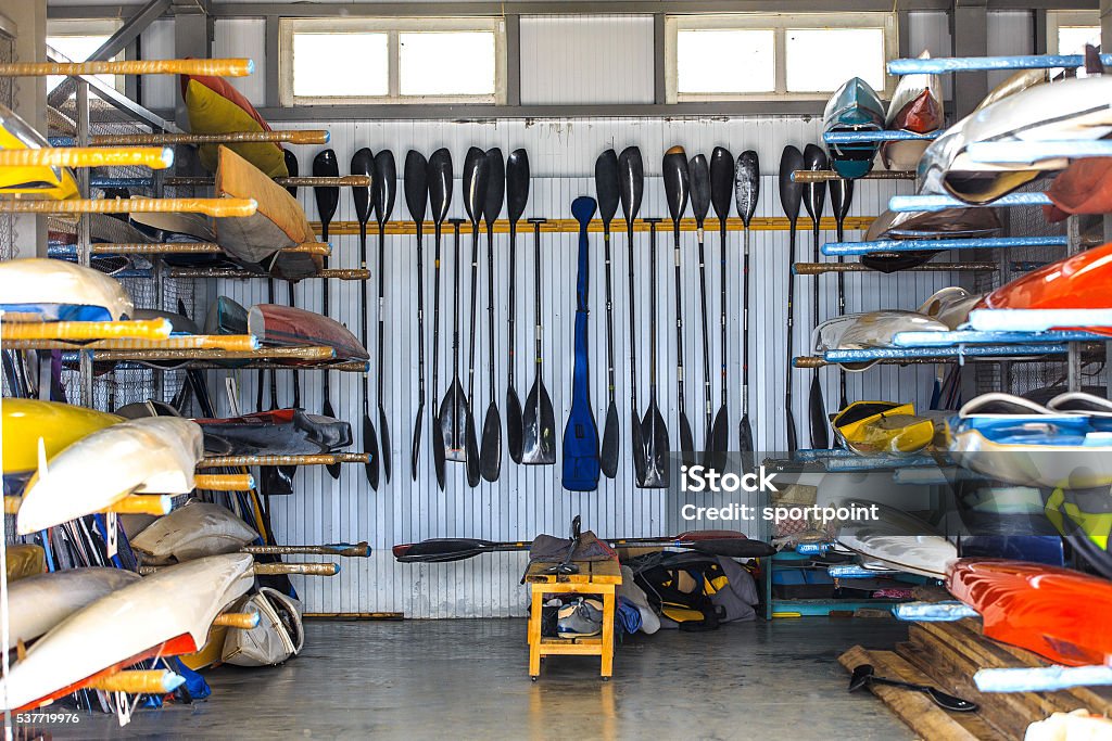 warehouse for storage of boats warehouse for storage of boats, canoes and kayaks, paddle Crew Stock Photo