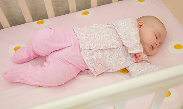 istock Very nice sweet baby sleeping in crib 537720284