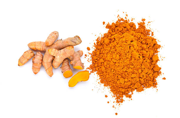 istock turmeric powder with turmeric root isolated on white 537720590