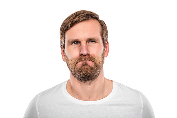 istock Young man in a white shirt is thinking intensely. 537722718
