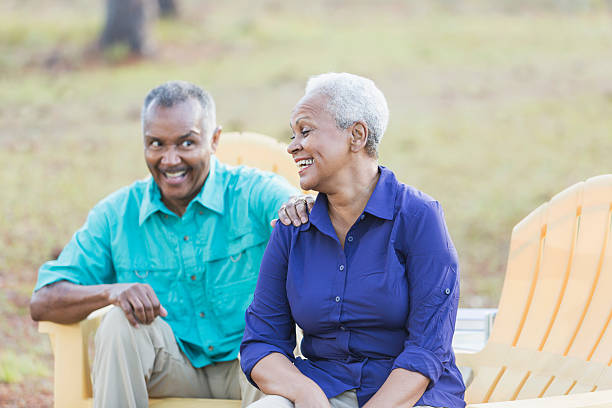istock Senior African American couple sitting outdoors laughing 537722872