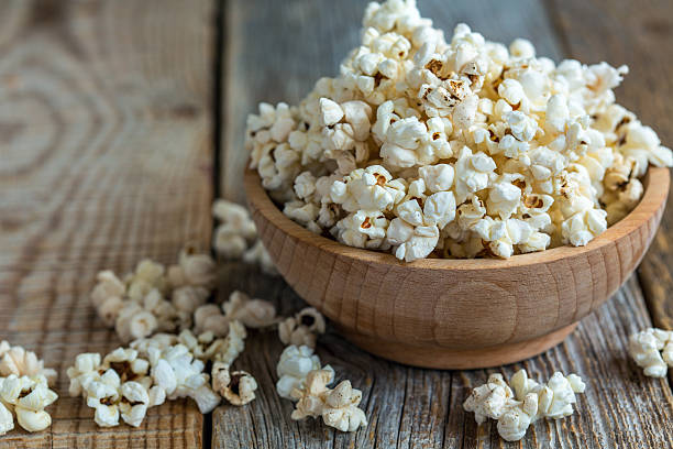 istock Popcorn in wooden bowl closeup. 537723114