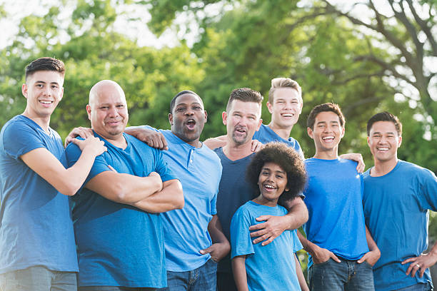 istock Multi-racial group of fathers and sons volunteering 537723422
