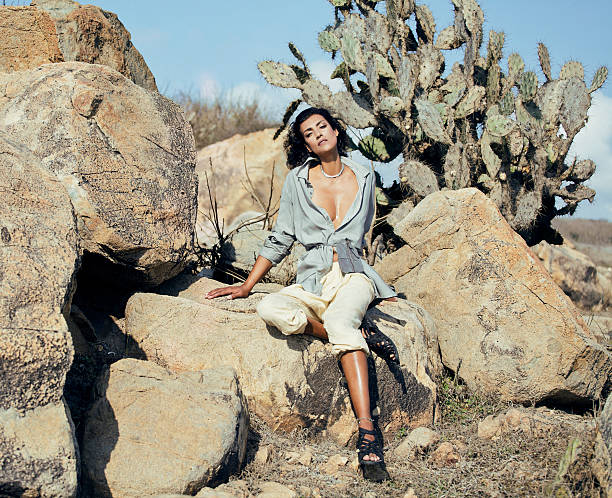 beauty young woman in savanna walking, dreaming, making notes, trip alone