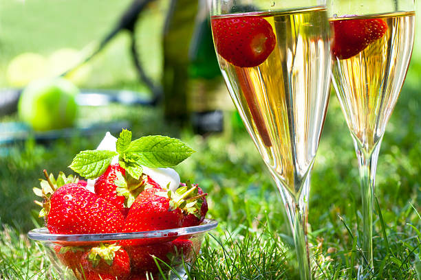 Strawberries with whipped cream and champagne stock photo