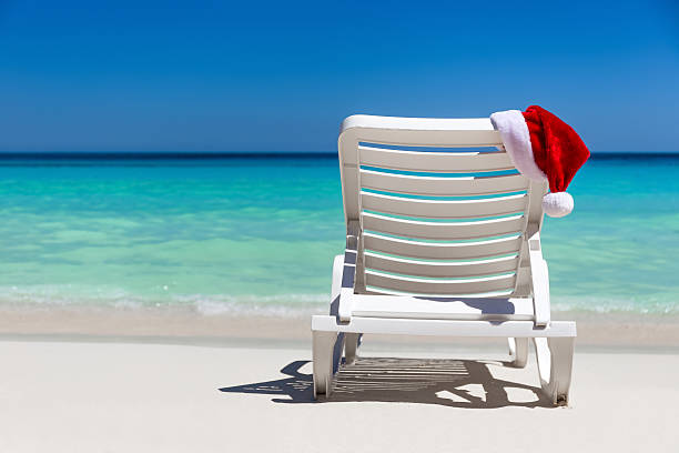istock Santa Claus Hat on sunbed near  tropical calm beach 537727982