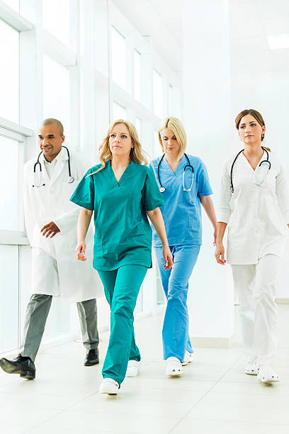 istock Team of doctors walking indoors. 537739503