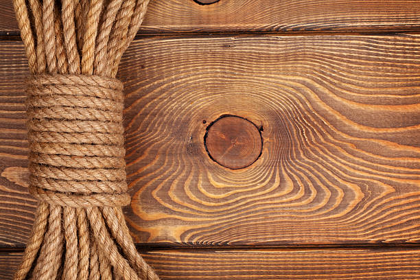 istock Wooden background with marine rope 537740159