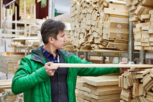 Man shopping for timber in DIY shop