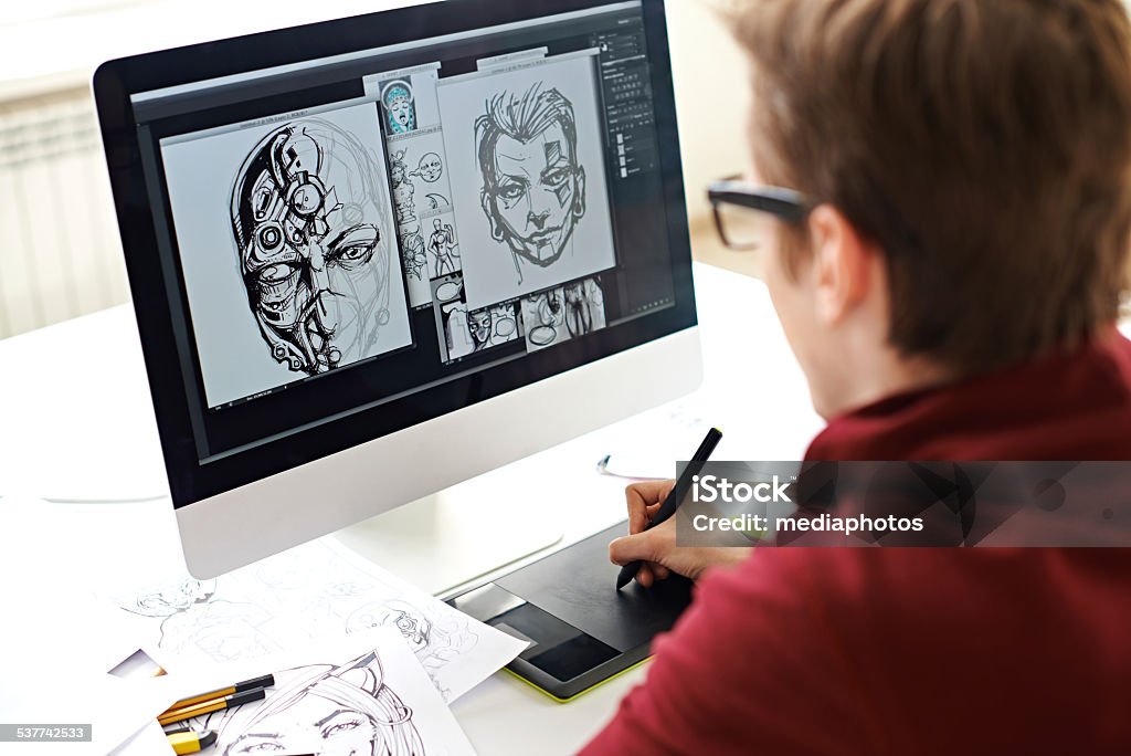 Comic book art Skilled comic artist creating comic book on computer Graphic Designer Stock Photo