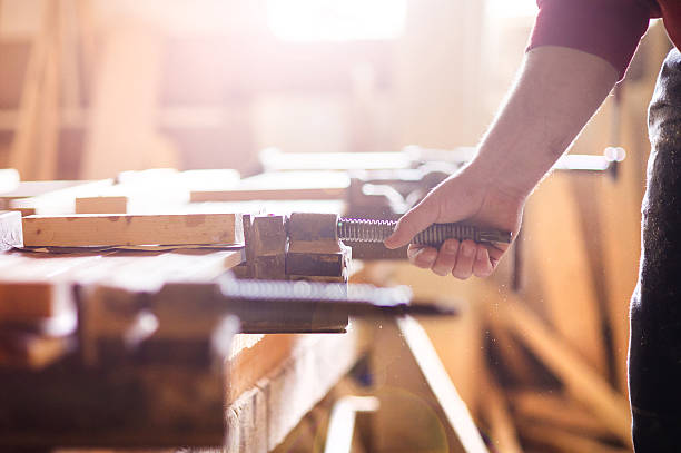 istock Carpenter gluing wooden planks 537743139