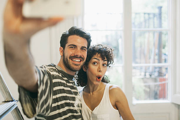 istock Making a selfie whie painting new apartment. 537743387