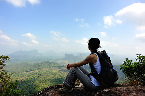 istock hiking woman enjoy the view on mountain peak 537760741