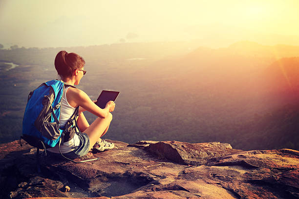 istock hiking woman use digital tablet on mountain peak 537760835