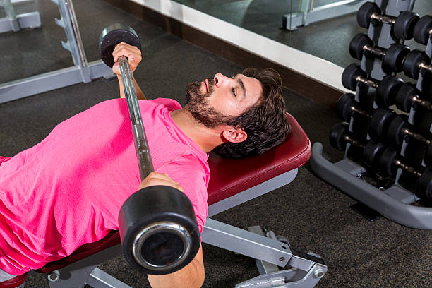 istock Barbell inclined bench Press flyes man workout 537761473