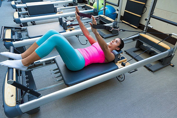 istock Pilates reformer workout exercises woman 537761825