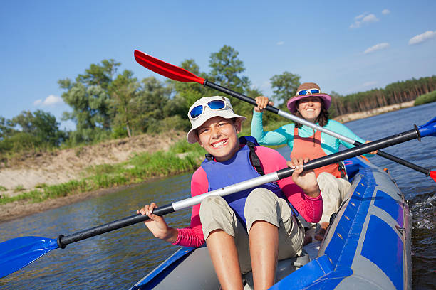 istock Girl with mother kayaking 537762963