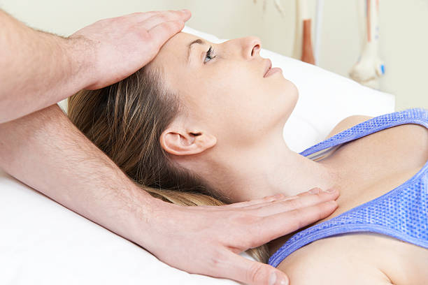 istock Male Osteopath Treating Female Patient With Neck Problem 537764239