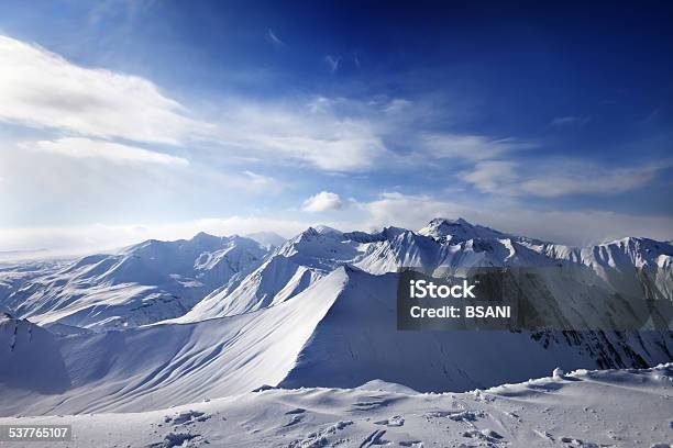 Snowy Mountains And Sunlight Sky Stock Photo - Download Image Now - 2015, Beauty In Nature, Blue
