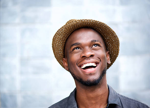 istock Cheerful young man laughing and looking up 537790499
