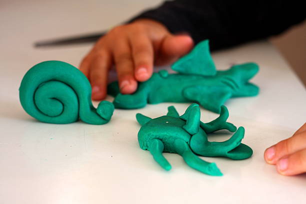 istock Preschooler Playing Making Animals from Playdough 537790697