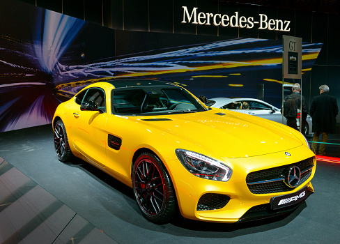 Brussels, Belgium - January 15, 2015: Mercedes-AMG GT coupe sports car on display during the 2015 Brussels motor show. People in the background are looking at the cars.