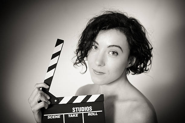 istock Seductive actress with clapperboard, vintage black and white 537793961