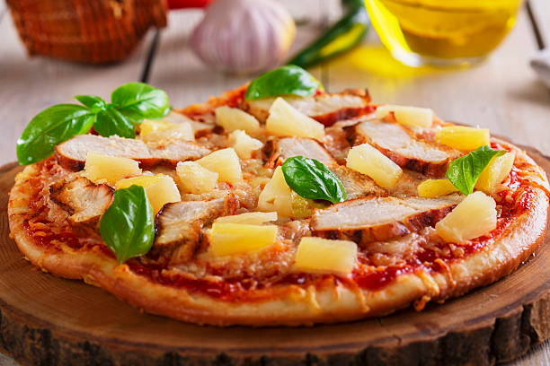 istock Pizza with cheese and pineapple chicken on board 537794097