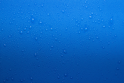 Rain water droplets on waterproof fabric.