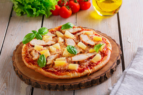 istock Pizza with cheese and pineapple chicken on board 537795667