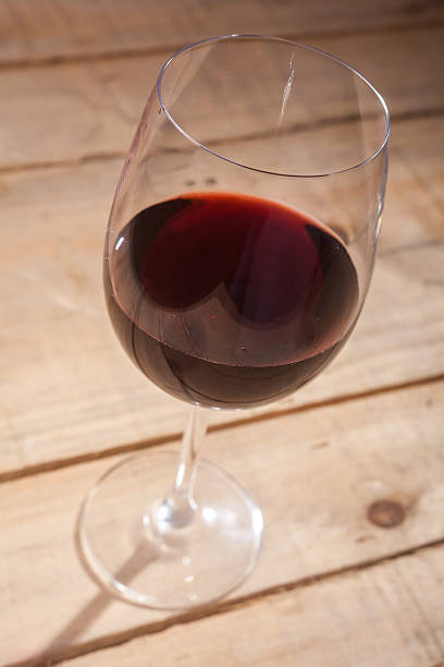 istock Glass of wine on wood 537804510