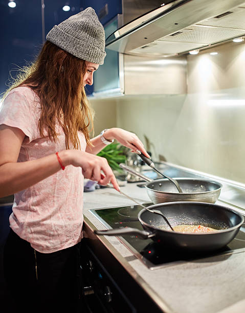 istock Woman cooking at home 537805958