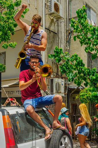 Tel-Aviv, Israel - June 3, 2016: People play music, as part of the Pride Parade in the streets of Tel-Aviv, Israel. Its part of an annual event of the LGBT community