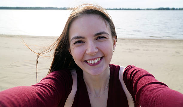 istock young woman doing selfie on your smartphone 537809198