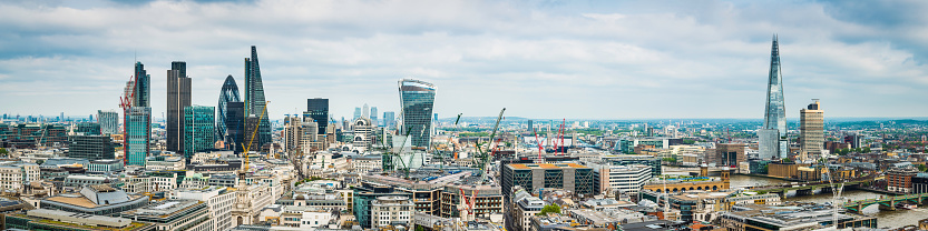 London, United Kingdom, November 16, 2023. Gherkin Tower in the square mile financial district. Dramatic futuristic modern city architecture. Overcast autumn winter day outdoors