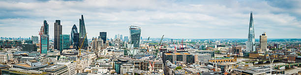 City of London skyscrapers and The Shard highrise cityscape panorama Elevated panoramic view over the landmark skyscrapers of the City of London Square Mile downtown financial district, from the Heron Tower, Tower 42, Broadgate Tower, the Gherkin, Cheesegrater  and Walkie Talkie across the River Thames and Tower of London to the gleaming spire of The Shard. ProPhoto RGB profile for maximum color fidelity and gamut. 20 fenchurch street photos stock pictures, royalty-free photos & images